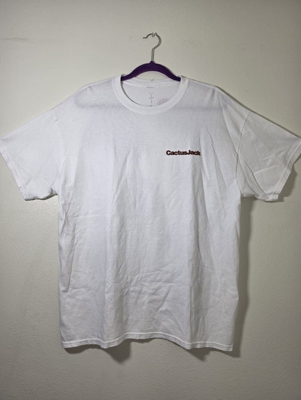 This is a white Travis Scott x McDonald's "Rules" t-shirt Large
